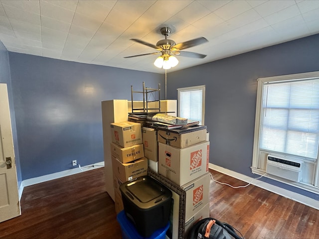 interior space featuring ceiling fan and dark wood-type flooring