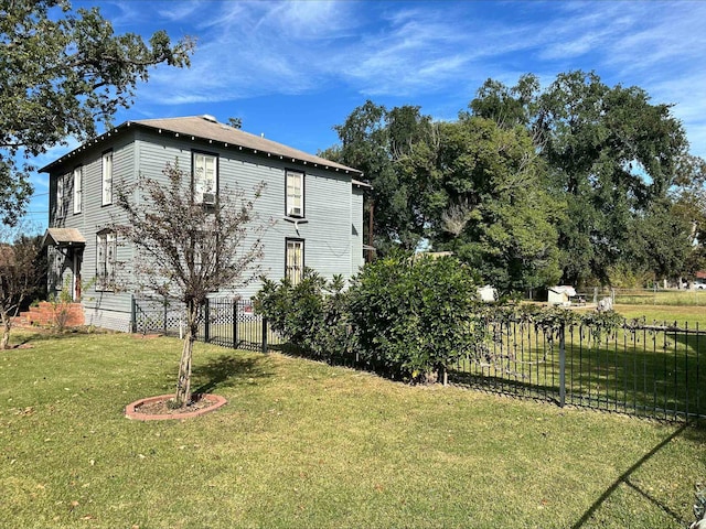 view of side of property featuring a yard