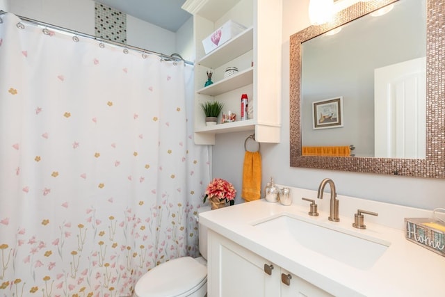 bathroom with vanity, toilet, and a shower with curtain