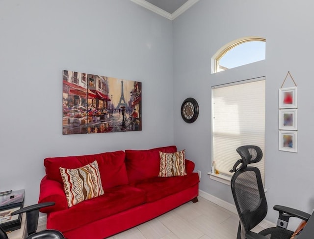 office area with baseboards and crown molding