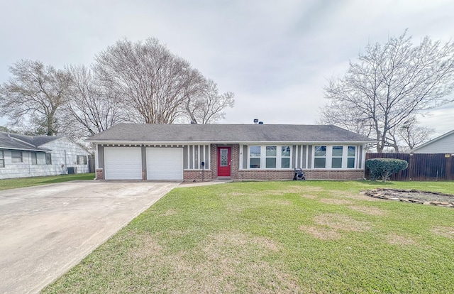 ranch-style home featuring an attached garage, brick siding, fence, concrete driveway, and a front yard