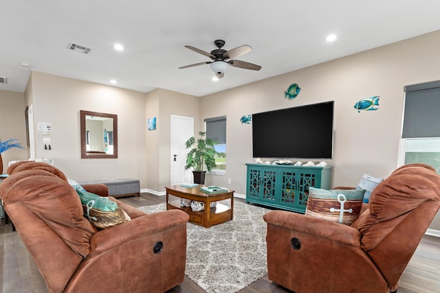 living room with a ceiling fan, visible vents, wood finished floors, and recessed lighting
