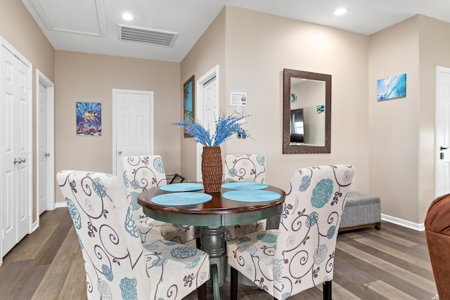 dining space with recessed lighting, visible vents, baseboards, and wood finished floors