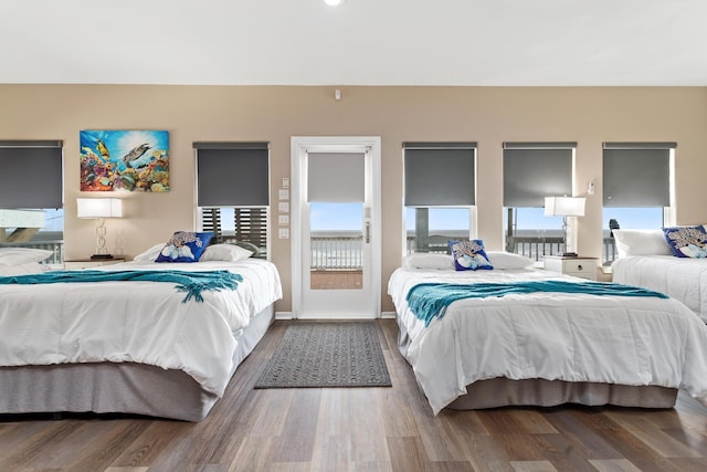 bedroom featuring wood finished floors and baseboards