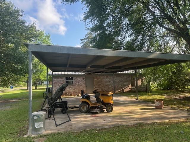 view of vehicle parking featuring a carport