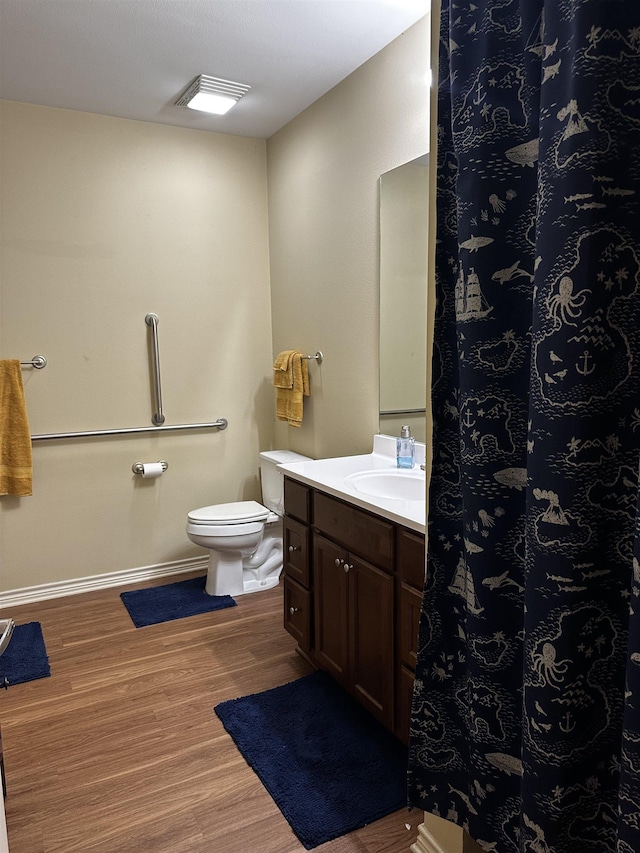 full bathroom with vanity, toilet, baseboards, wood finished floors, and a shower with curtain