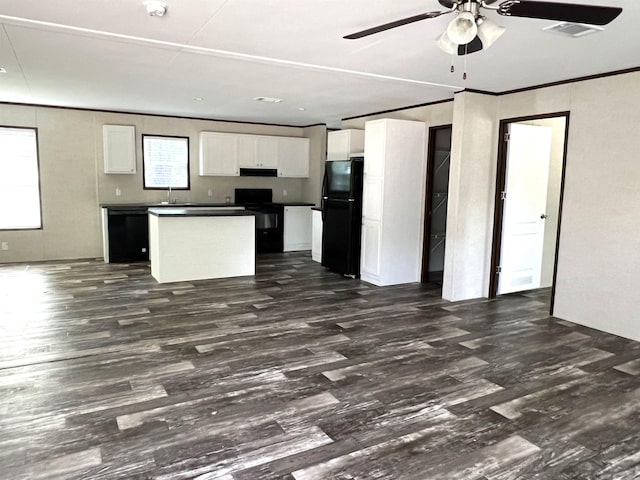 kitchen with a center island, black appliances, white cabinets, ceiling fan, and dark hardwood / wood-style flooring