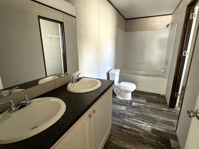 full bathroom with toilet, vanity, tub / shower combination, and hardwood / wood-style flooring