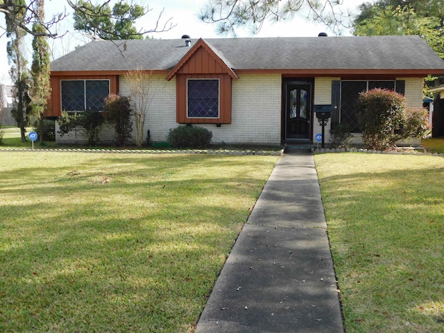 view of front of home with a front lawn