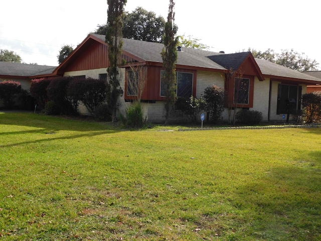 view of property exterior featuring a lawn