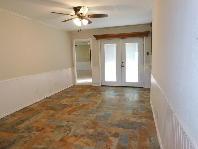 interior space featuring ceiling fan and french doors