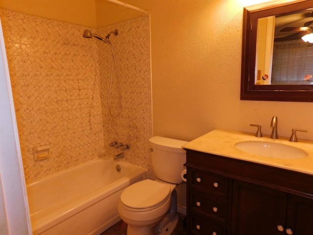 full bathroom with bathing tub / shower combination, ceiling fan, vanity, and toilet