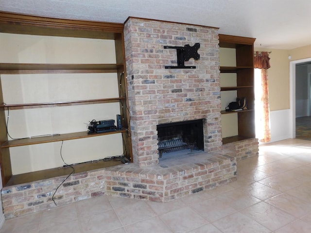 unfurnished living room with light tile patterned floors and a fireplace