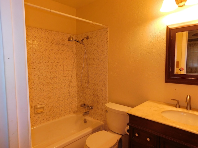 full bathroom with vanity, toilet, and tiled shower / bath