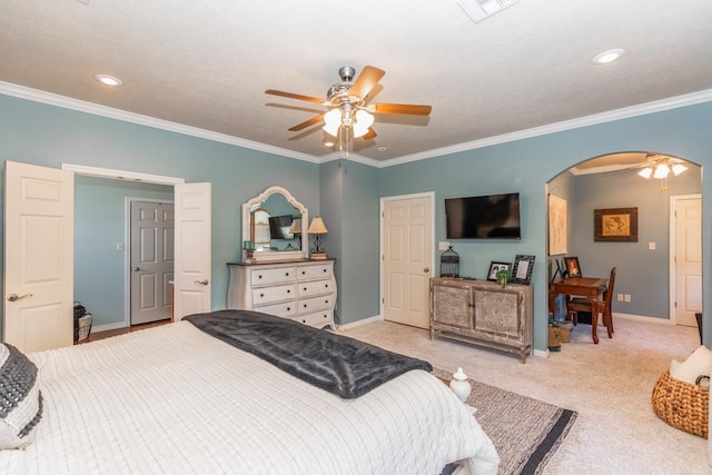 bedroom with ceiling fan, light colored carpet, and ornamental molding