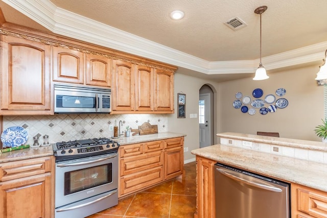 kitchen featuring dark tile patterned floors, crown molding, decorative light fixtures, decorative backsplash, and appliances with stainless steel finishes