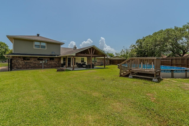 1405 Turner Dr, Bridge City, TX 77611 - fenced backyard with a patio area