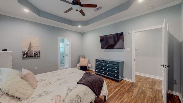 1405 Turner Dr, Bridge City, TX 77611 - bedroom featuring wood finished floors, recessed lighting, a raised ceiling, ensuite bathroom, and ceiling fan