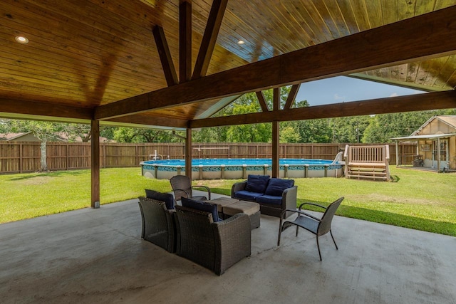 1405 Turner Dr, Bridge City, TX 77611 - fenced backyard featuring an outdoor hangout area and a patio