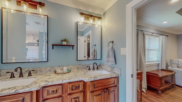 1405 Turner Dr, Bridge City, TX 77611 - full bath featuring crown molding, wood finished floors, and double vanity