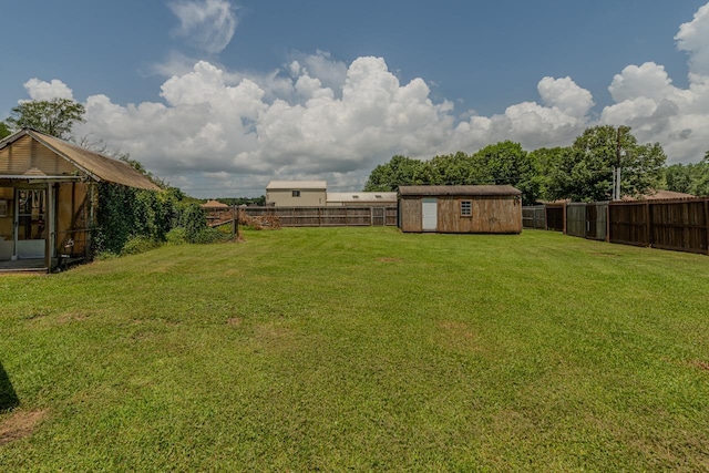 1405 Turner Dr, Bridge City, TX 77611 - fenced backyard featuring a storage unit