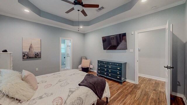 1405 Turner Dr, Bridge City, TX 77611 - bedroom featuring wood finished floors, recessed lighting, a raised ceiling, ensuite bathroom, and ceiling fan