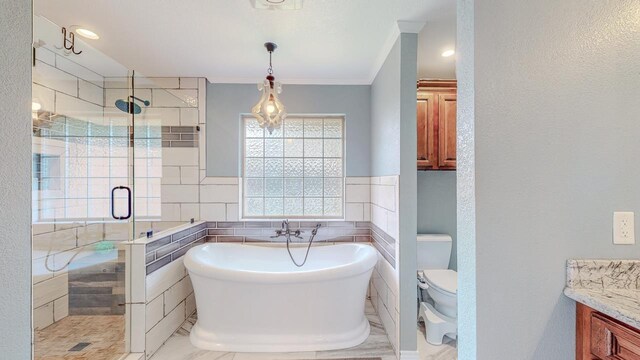 1405 Turner Dr, Bridge City, TX 77611 - bathroom with a freestanding tub, a stall shower, vanity, tile walls, and crown molding