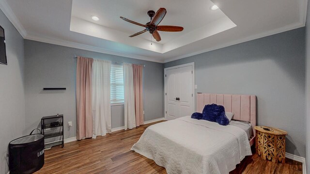 1405 Turner Dr, Bridge City, TX 77611 - bedroom with a raised ceiling, wood finished floors, recessed lighting, ceiling fan, and crown molding