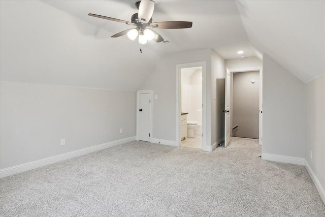 bonus room featuring light colored carpet, vaulted ceiling, and ceiling fan