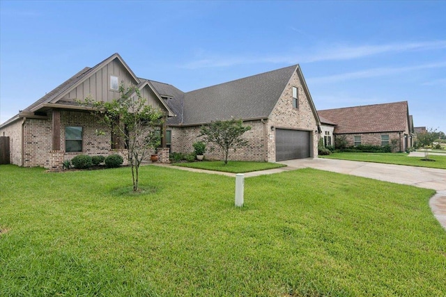 view of front of house featuring a garage and a front lawn