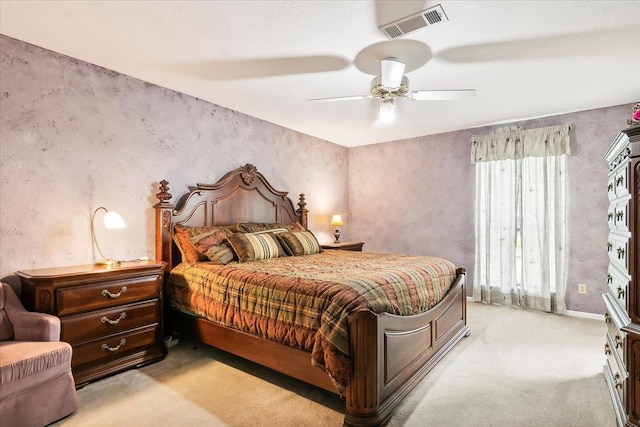 bedroom with light carpet and ceiling fan