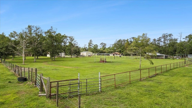 view of yard with a rural view