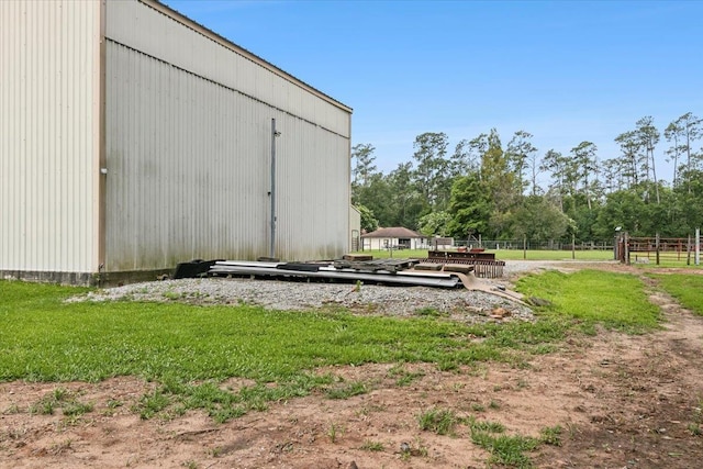 view of outbuilding featuring a lawn