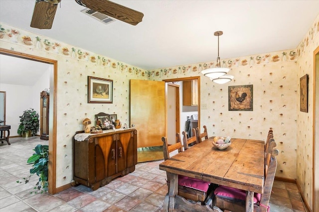 dining space featuring ceiling fan