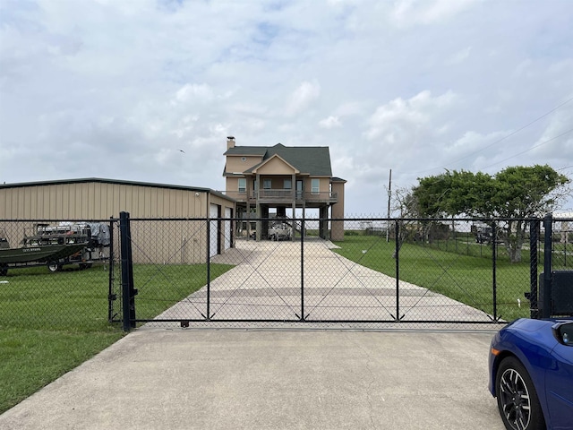 view of gate featuring a yard