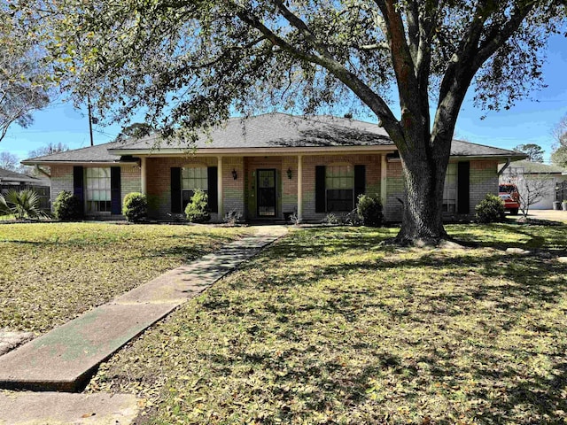 single story home with a front lawn and brick siding