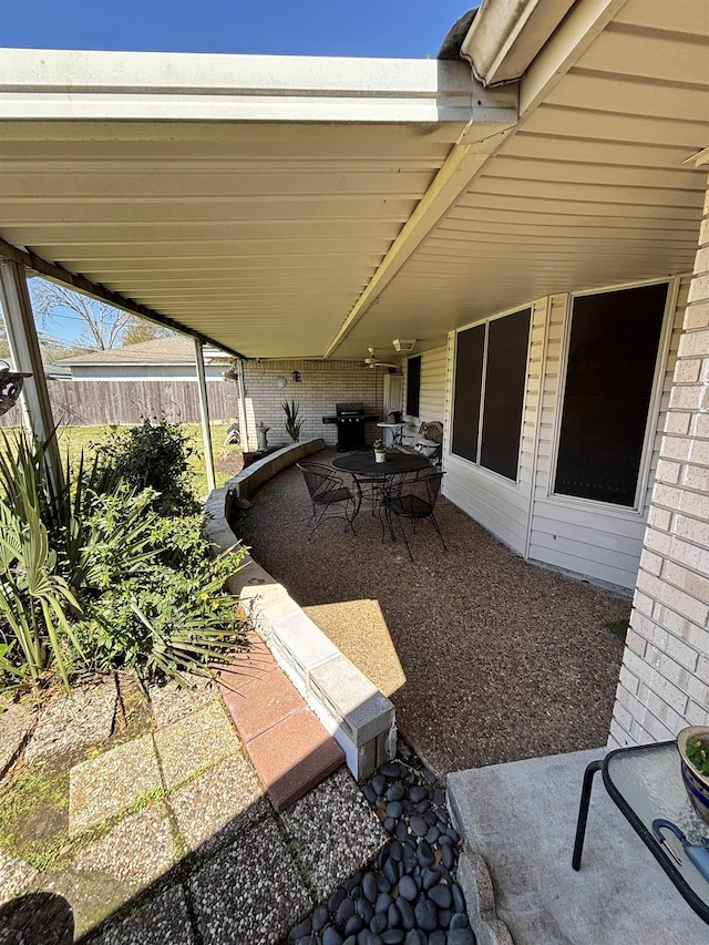 view of patio / terrace featuring fence