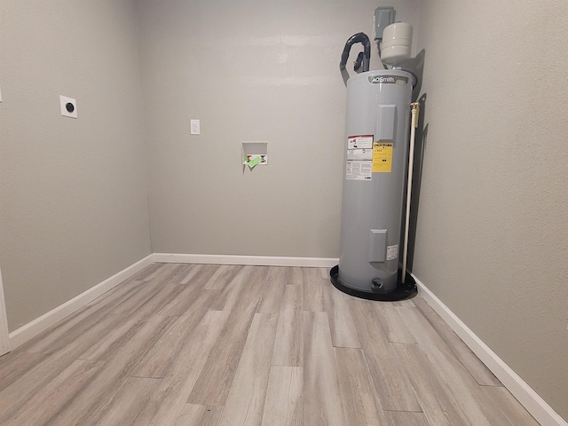 utility room featuring electric water heater