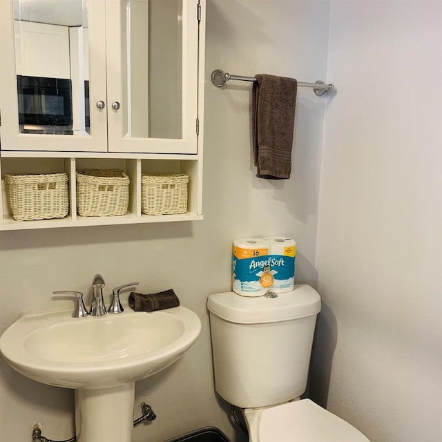 bathroom with sink and toilet