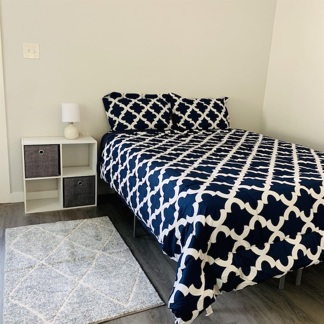 bedroom with hardwood / wood-style flooring