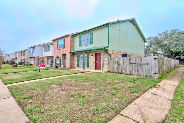 view of property with a front lawn