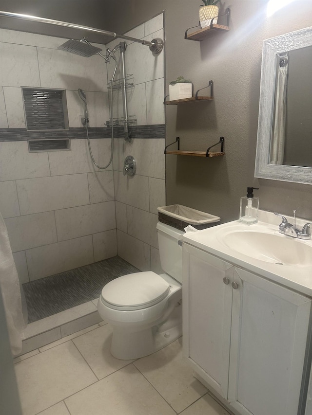 5041 9th St, Port Arthur, TX 77642 - bathroom featuring a stall shower, toilet, vanity, and tile patterned floors