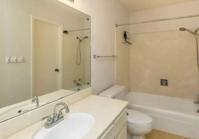 bathroom featuring shower / bath combination, vanity, and toilet