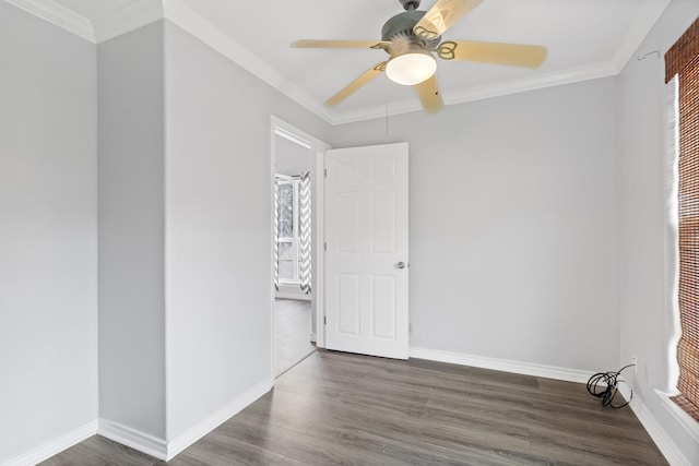 930 Llano St, Port Neches, TX 77651 - empty room with dark wood-style flooring, ceiling fan, baseboards, and crown molding