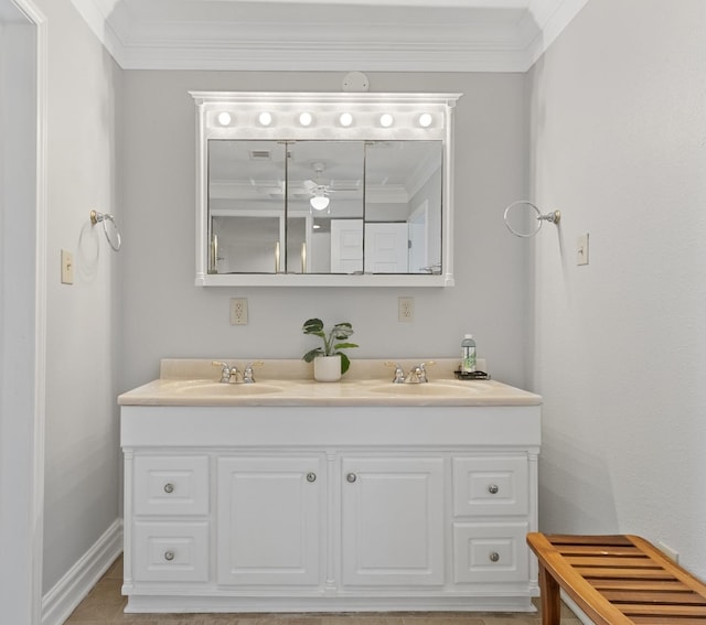 930 Llano St, Port Neches, TX 77651 - bathroom with ornamental molding, double vanity, and baseboards