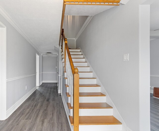 930 Llano St, Port Neches, TX 77651 - stairway featuring wood finished floors, baseboards, and crown molding