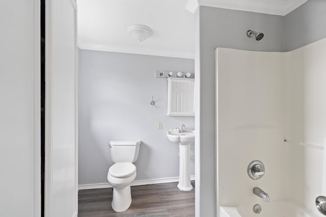 930 Llano St, Port Neches, TX 77651 - full bathroom featuring toilet, ornamental molding, wood finished floors, baseboards, and bathtub / shower combination