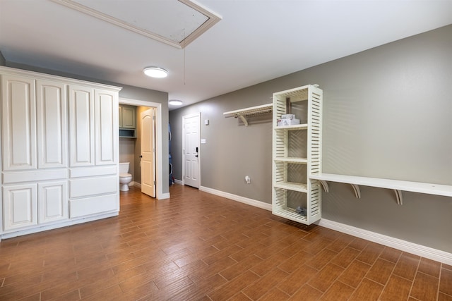 5269 Fairview Dr, Orange, TX 77630 - unfurnished bedroom with attic access, baseboards, and wood finished floors
