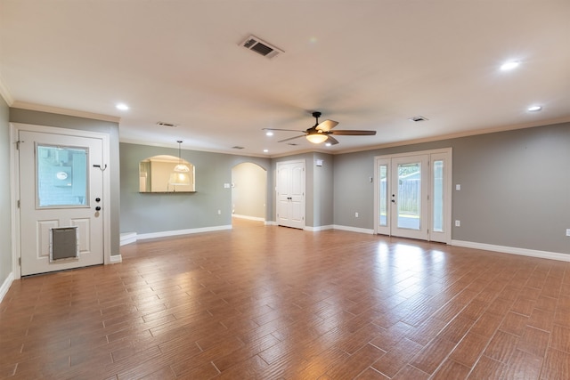 5269 Fairview Dr, Orange, TX 77630 - unfurnished living room featuring ceiling fan, crown molding, recessed lighting, arched walkways, and baseboards