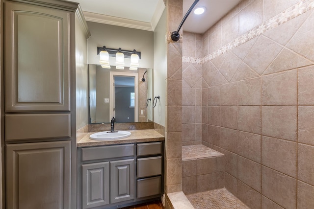 5269 Fairview Dr, Orange, TX 77630 - bathroom featuring ornamental molding, tiled shower, and vanity